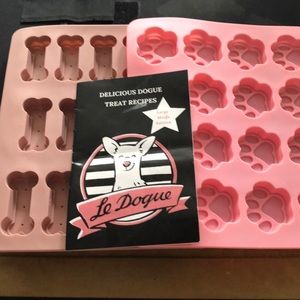 2 silicone dog treat molds with a recipe book